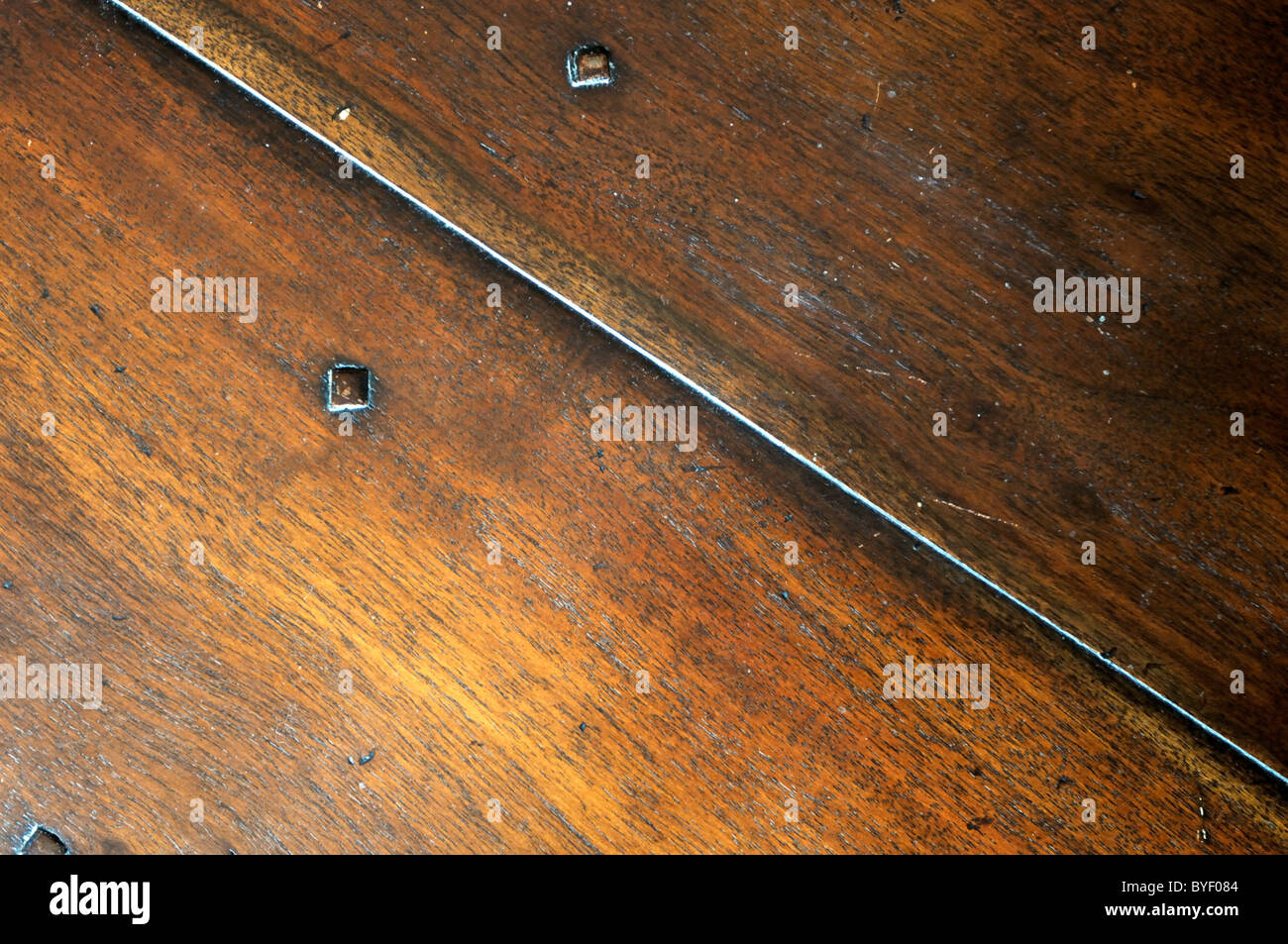 Wooden walnut table surface. Stock Photo