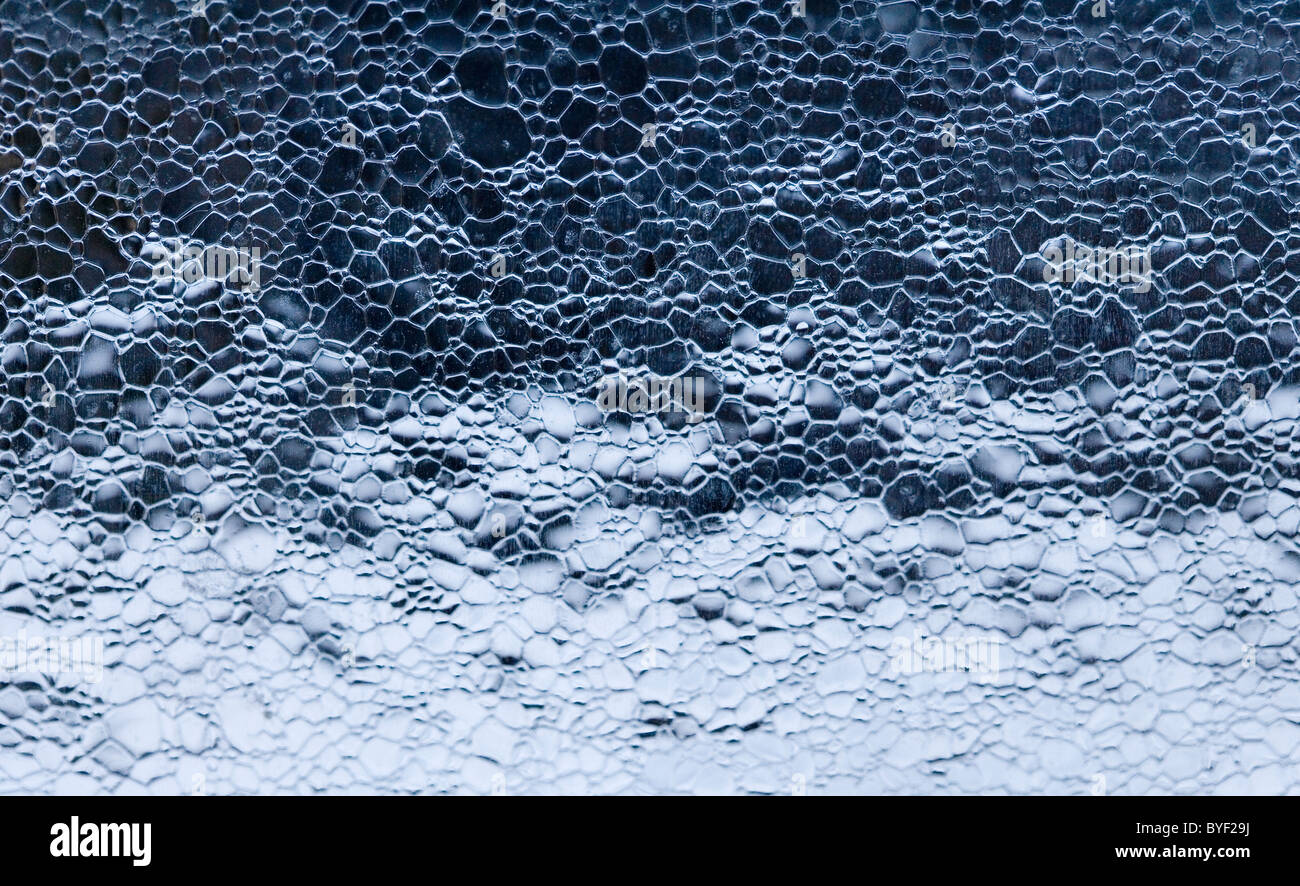 A thin layer of ice on an auto windshield or windscreen Stock Photo