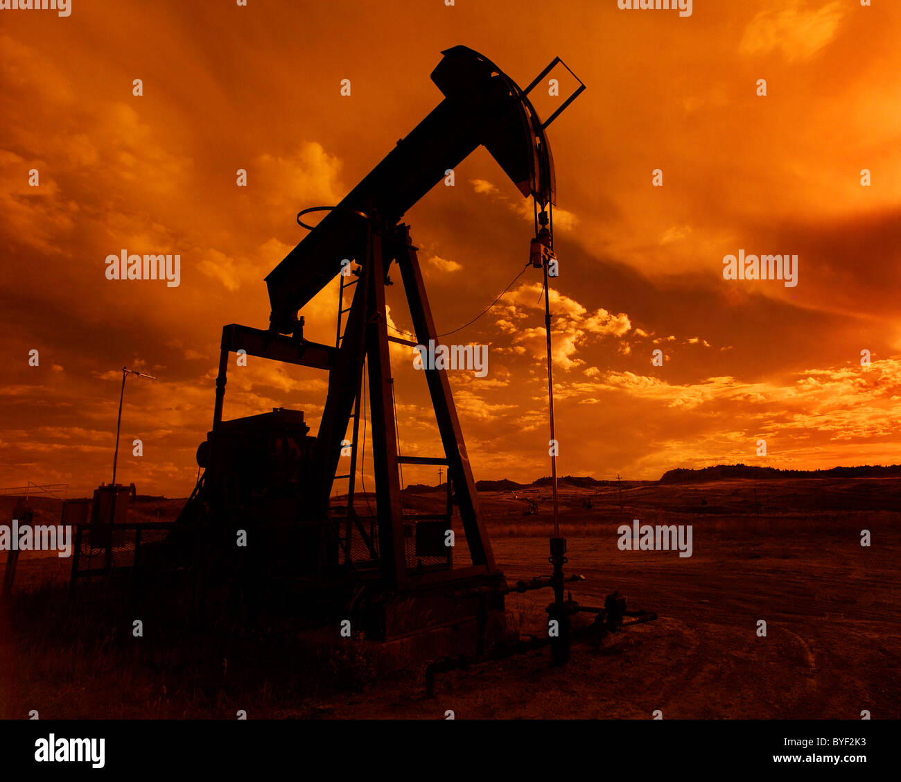 A pumpjack working away at sunset Stock Photo Alamy