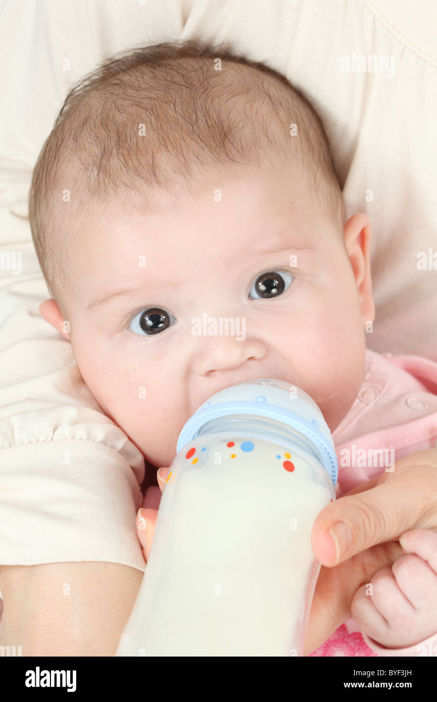 Feeding four month old baby girl Stock Photo - Alamy