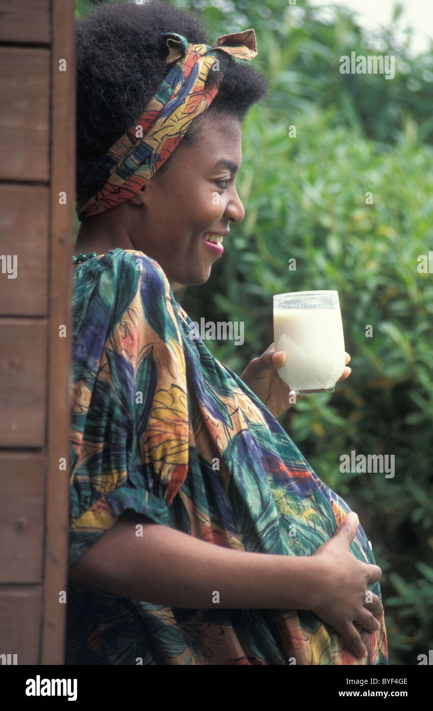 pregnant african woman drinking milk Stock Photo