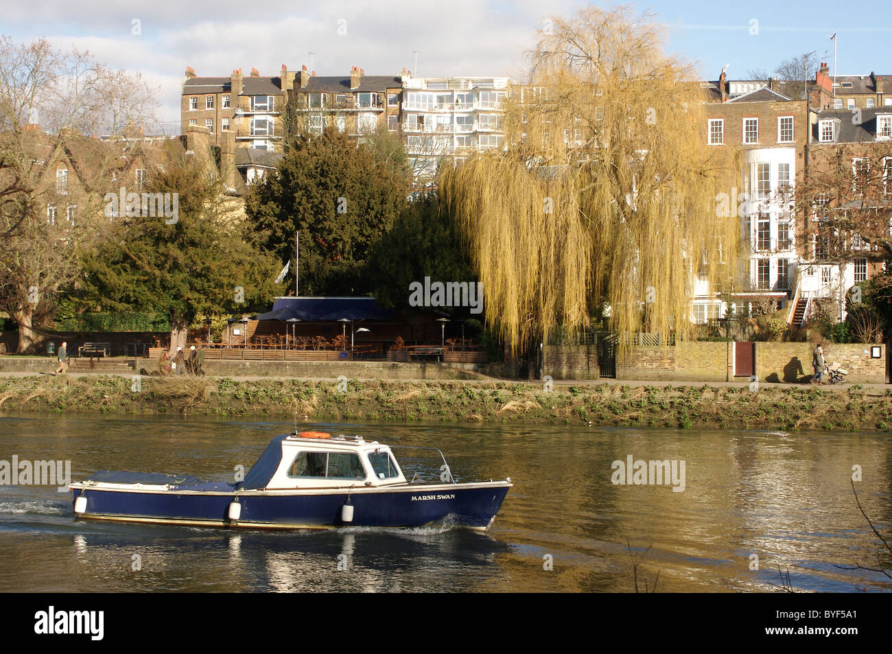 Boat cruising the River Thames near Richmond Upon Thames Stock Photo