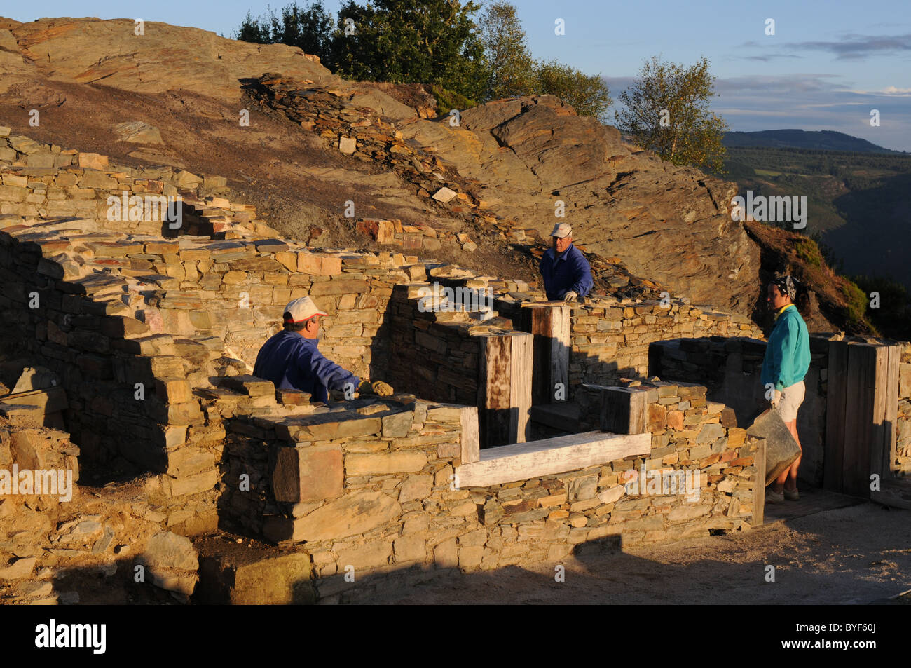 Workers in the rooms of the " Domus "   Archaeological site " Chao Samartin " Asturias SPAIN Stock Photo