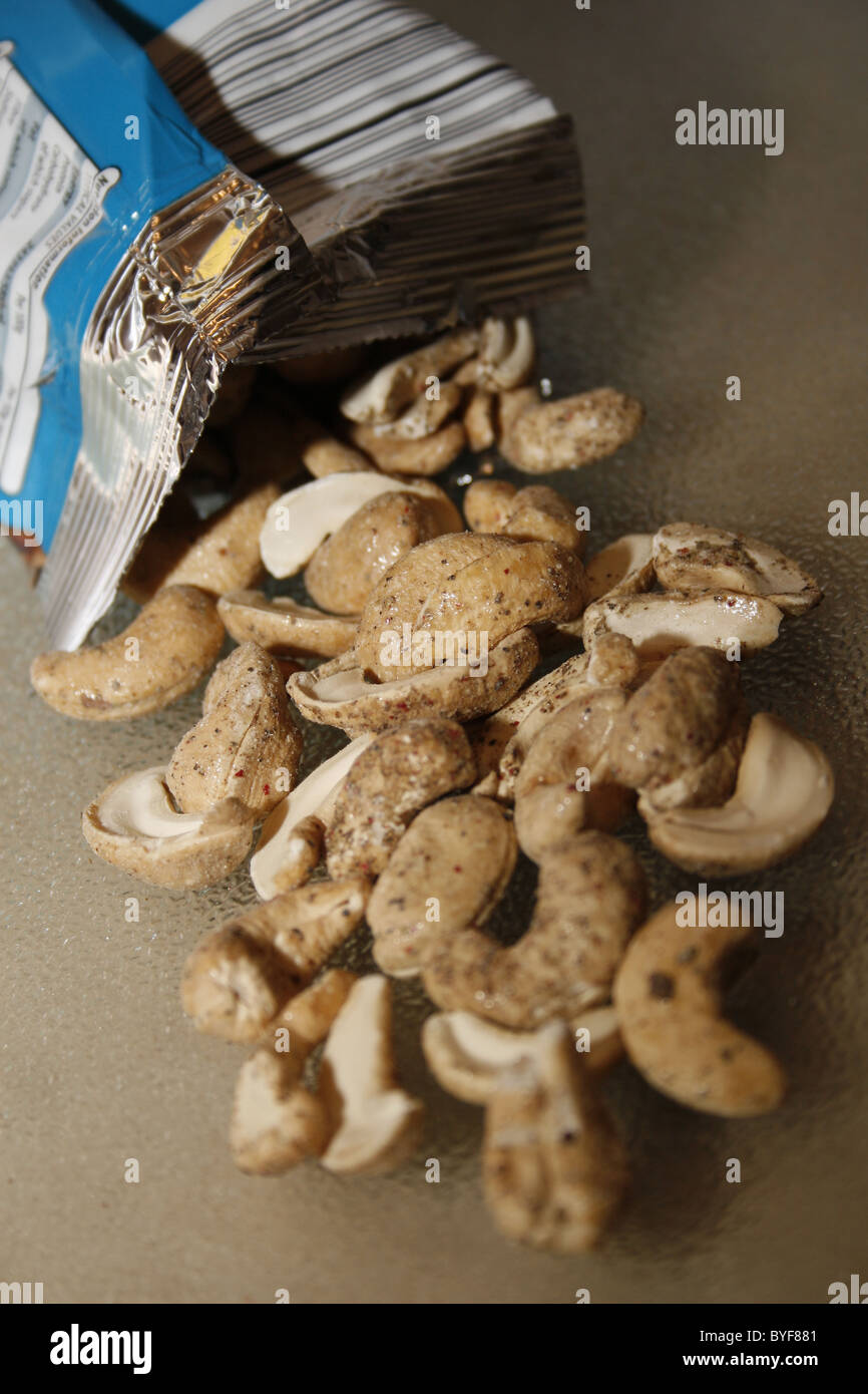 image of cashews covered in sea salt and cracked black pepper Stock Photo