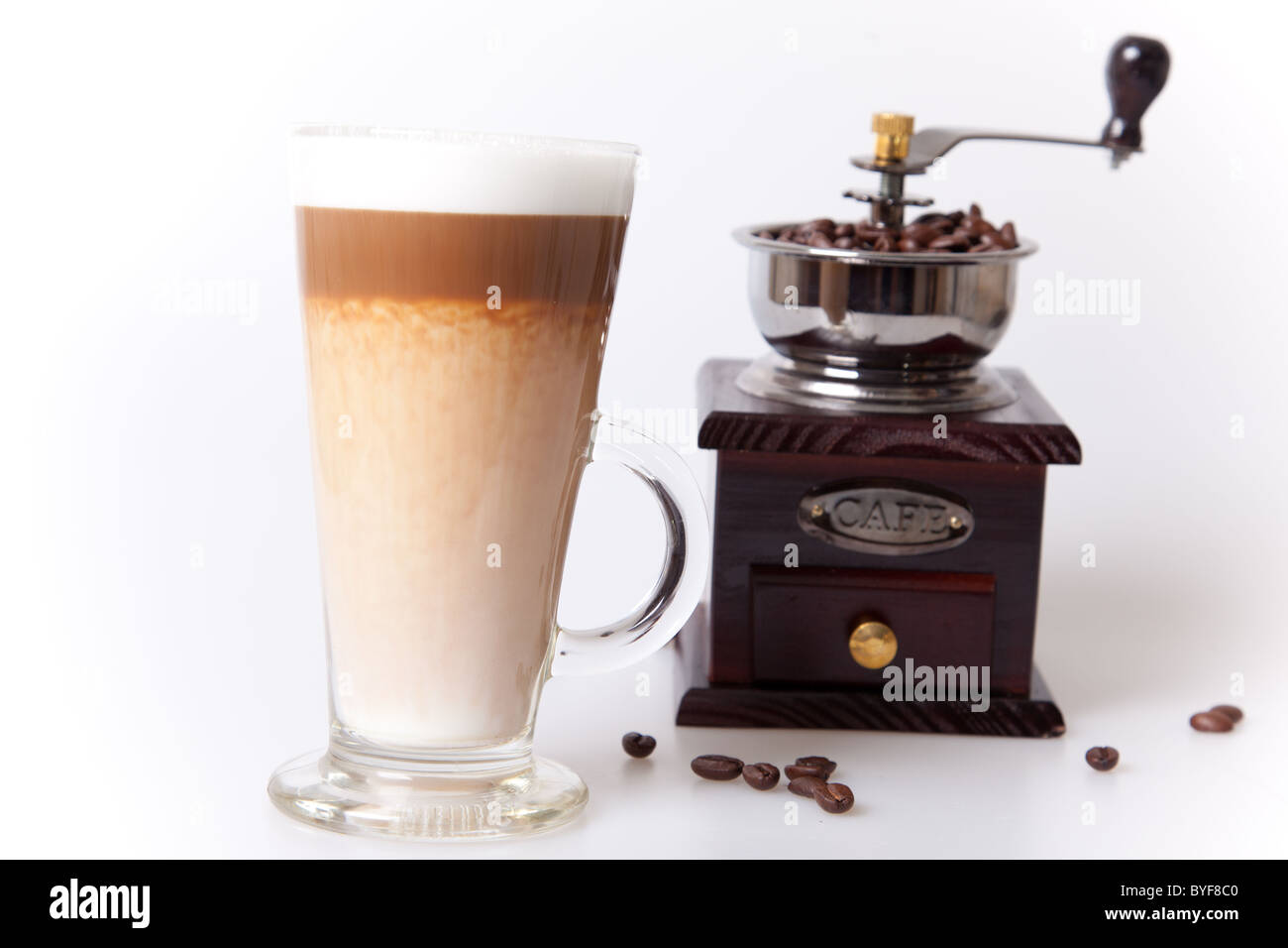 Coffee cup with coffee maker and beans in white background Stock Photo