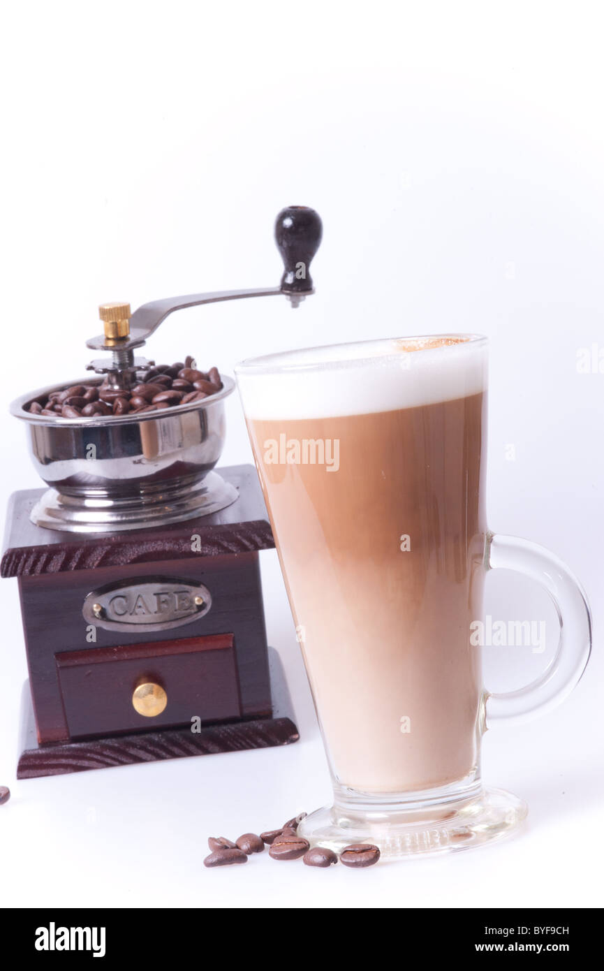 Coffee cup with coffee maker and beans in white background Stock Photo
