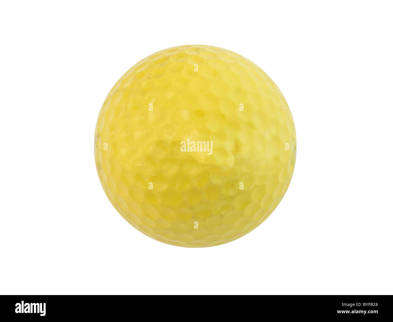 Yellow practice golf with a bit of wear and tear from the local driving range. Stock Photo