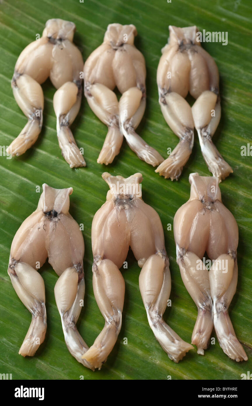 Frogs' legs on banana leaf. Cuisses de grenouille Stock Photo