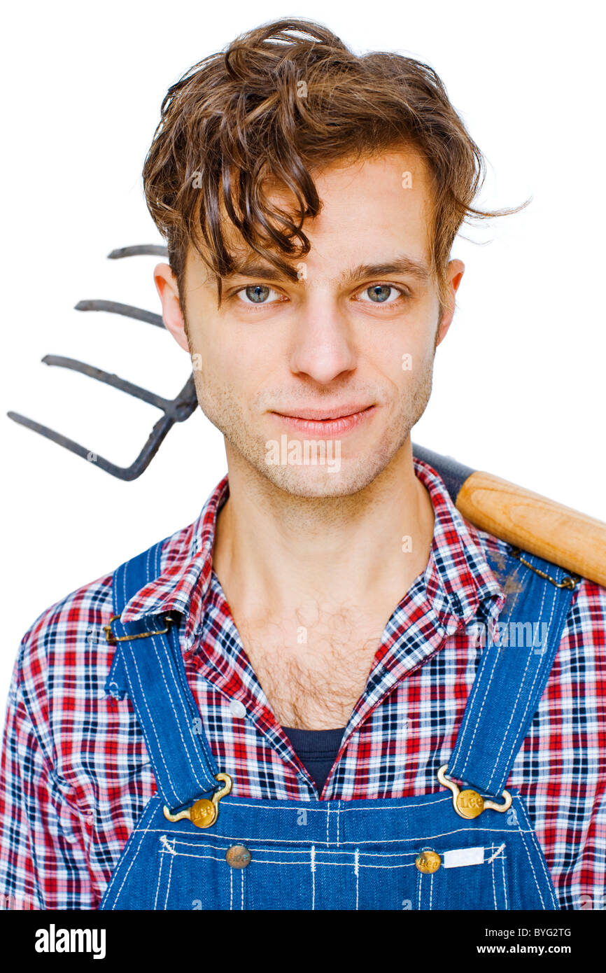 Studio shot of farmer with pitchfork Stock Photo