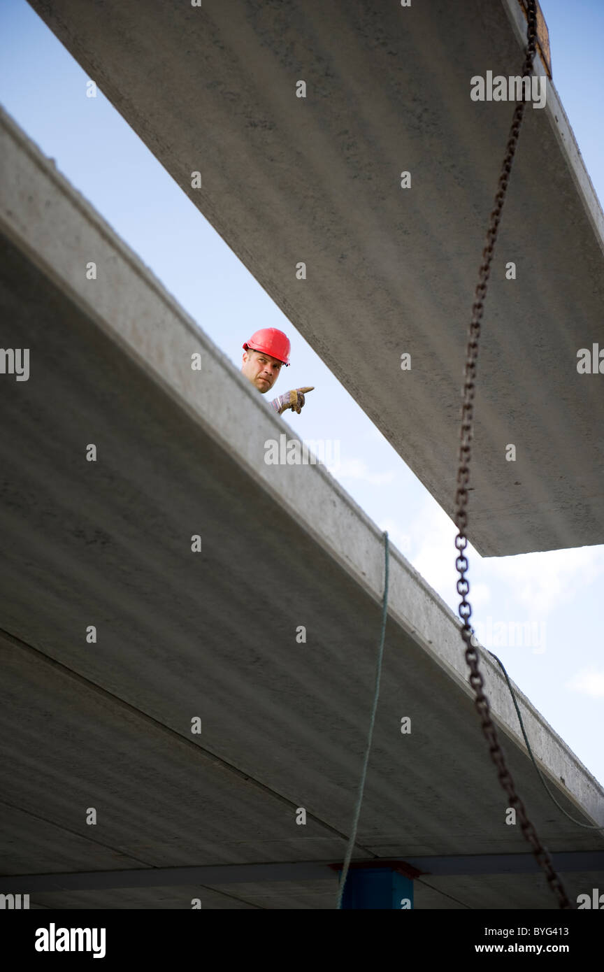 Worker at construction site Stock Photo - Alamy