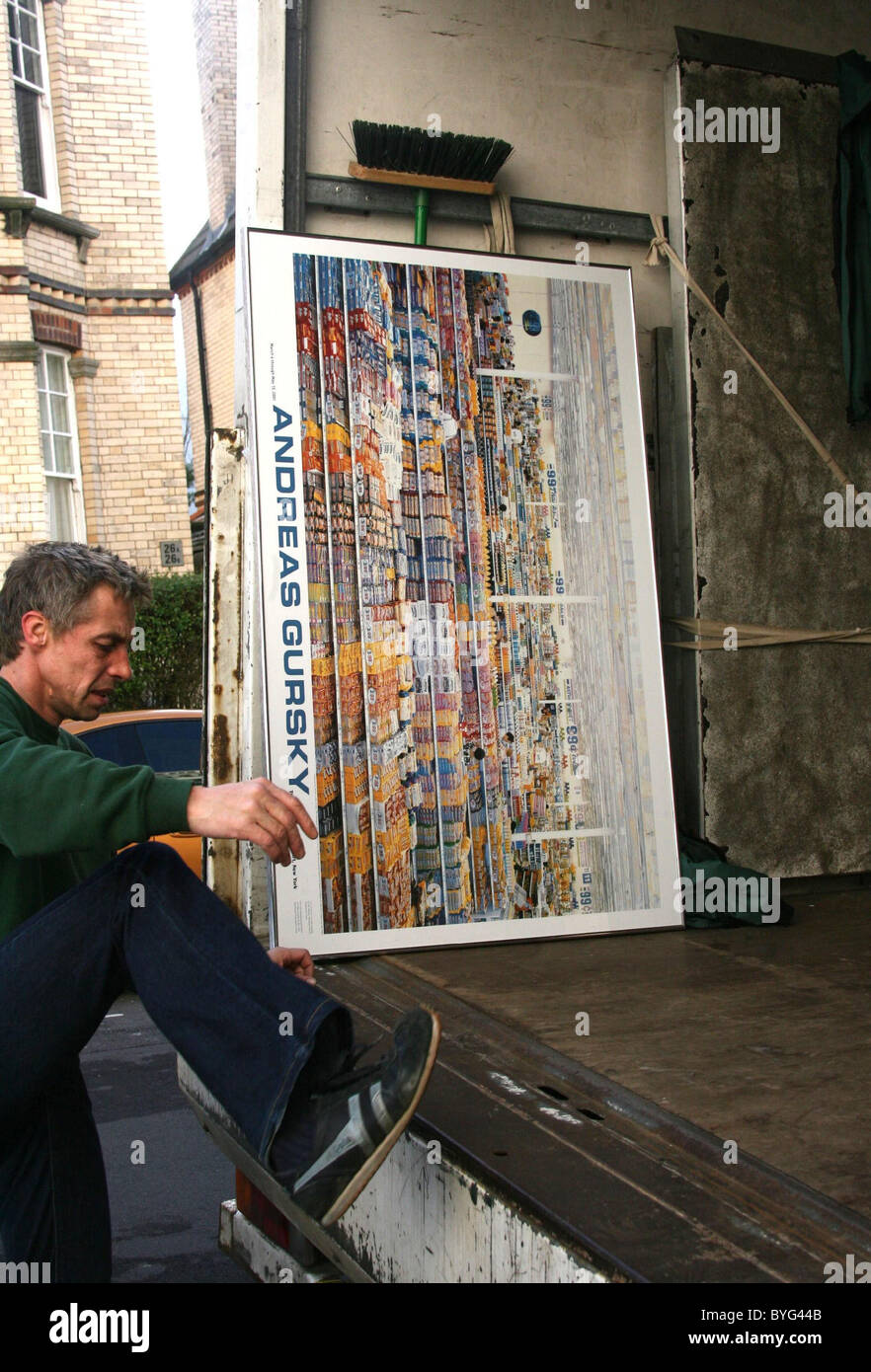 A framed Andreas is loaded into the van when Chantelle Houghton and Samuel Preston move house Brighton, England Photo - Alamy