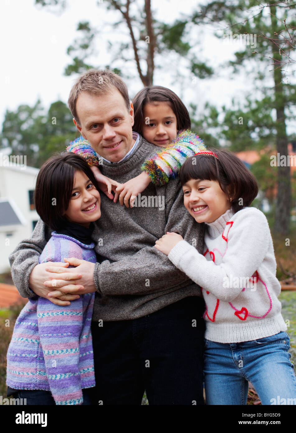 Father with three daughters Stock Photo Alamy