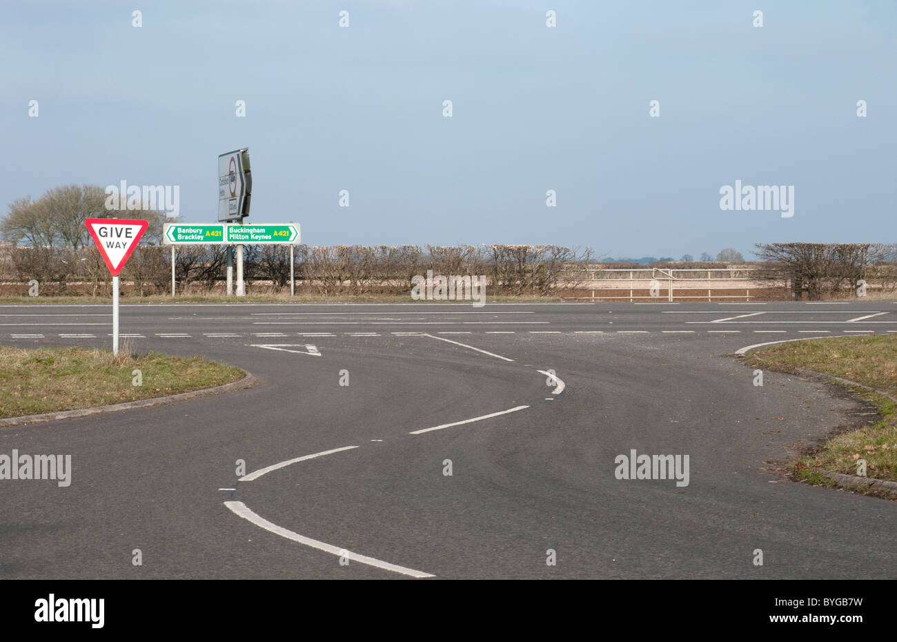 Give Way Sign at Road Junction Stock Photo