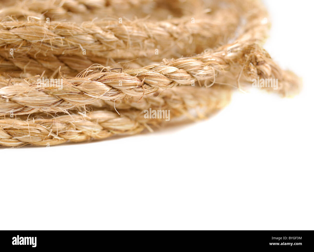 Jute rope bundle over white background Stock Photo Alamy