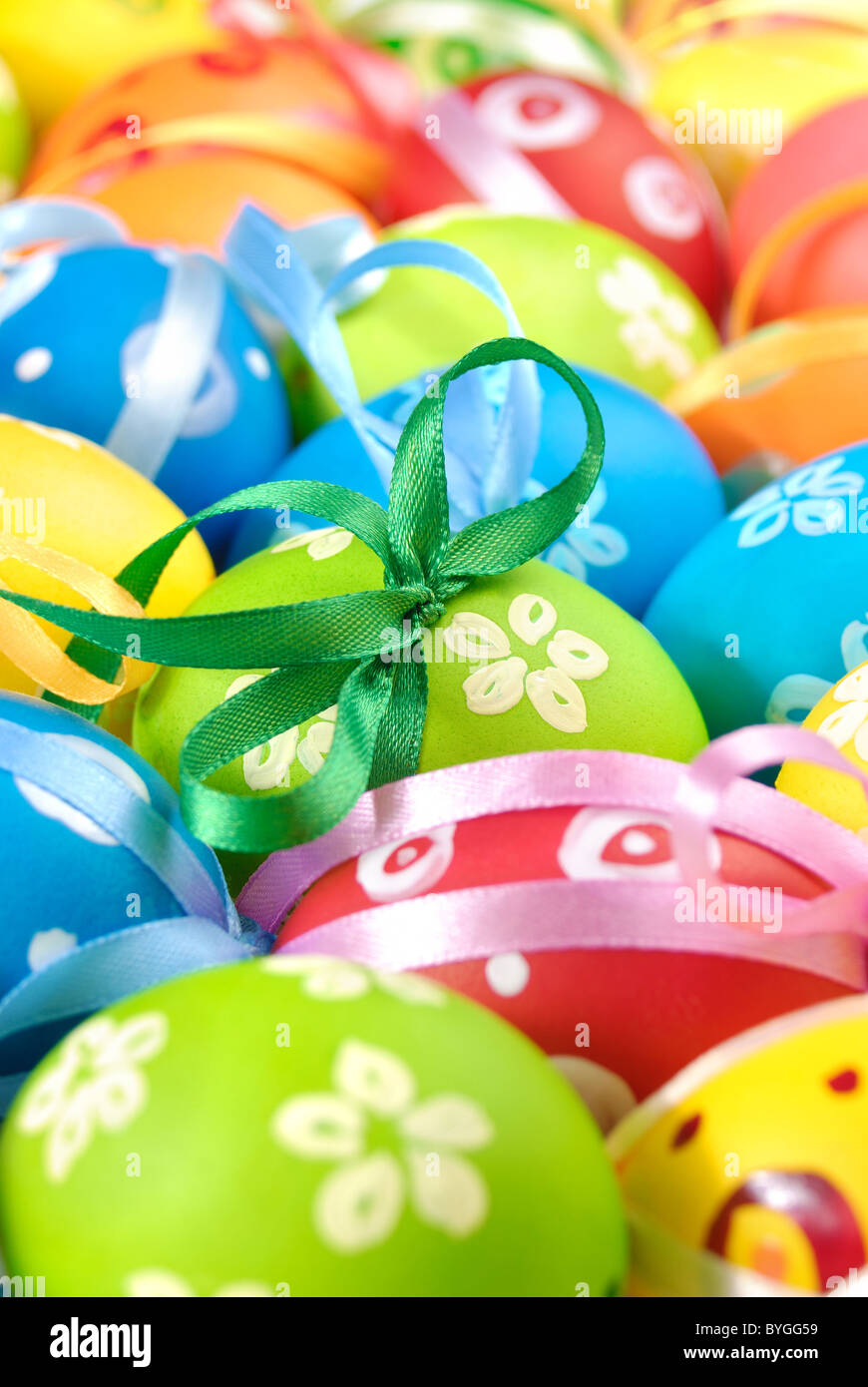 Painted easter eggs with bows uniform background Stock Photo - Alamy