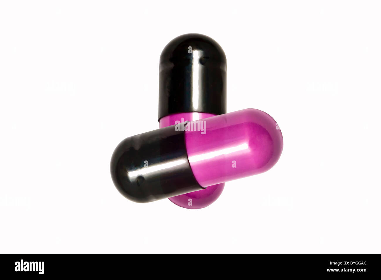 Pink capsules isolated on white background Stock Photo Alamy