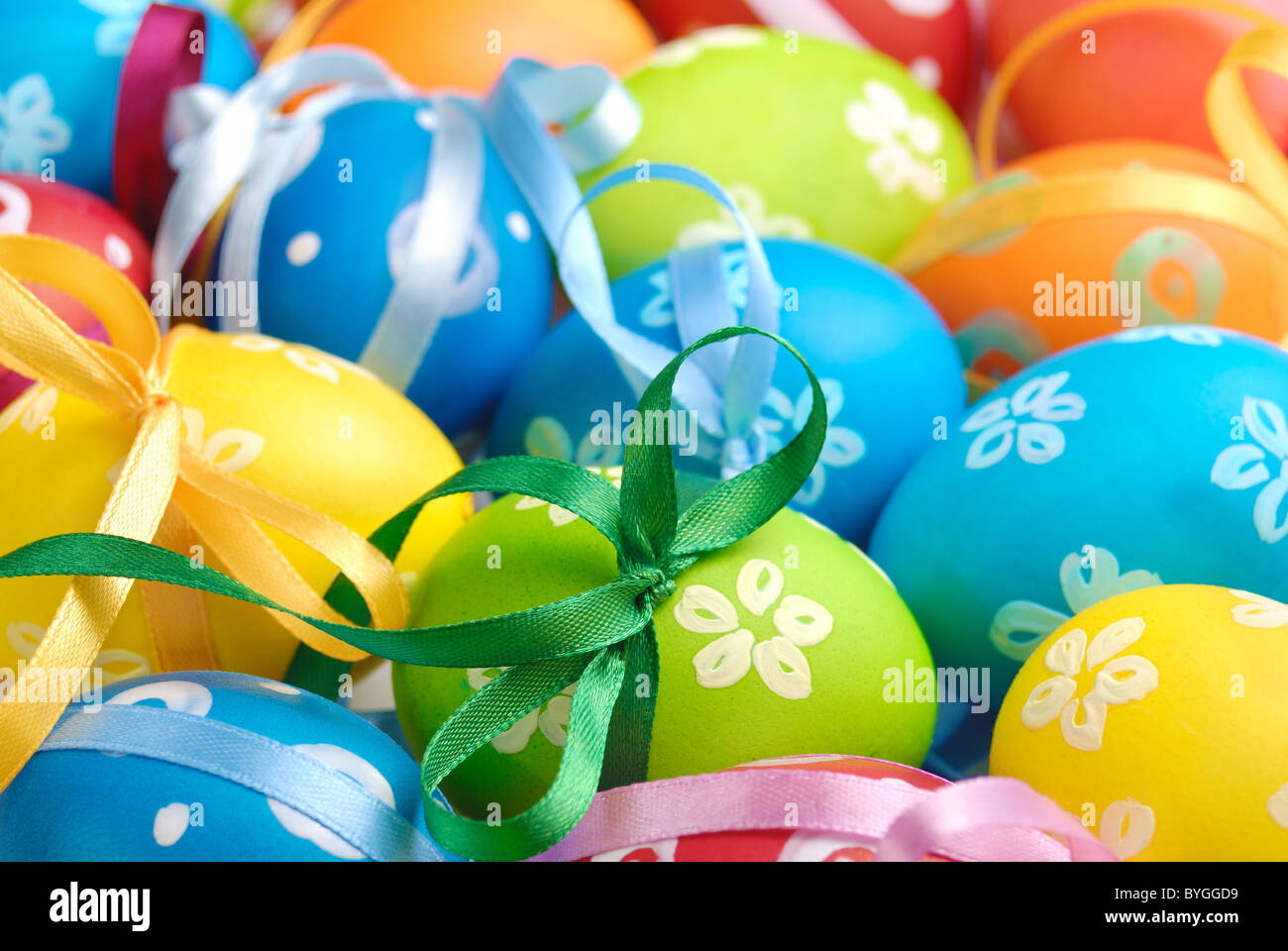 Painted easter eggs with bows uniform background Stock Photo - Alamy
