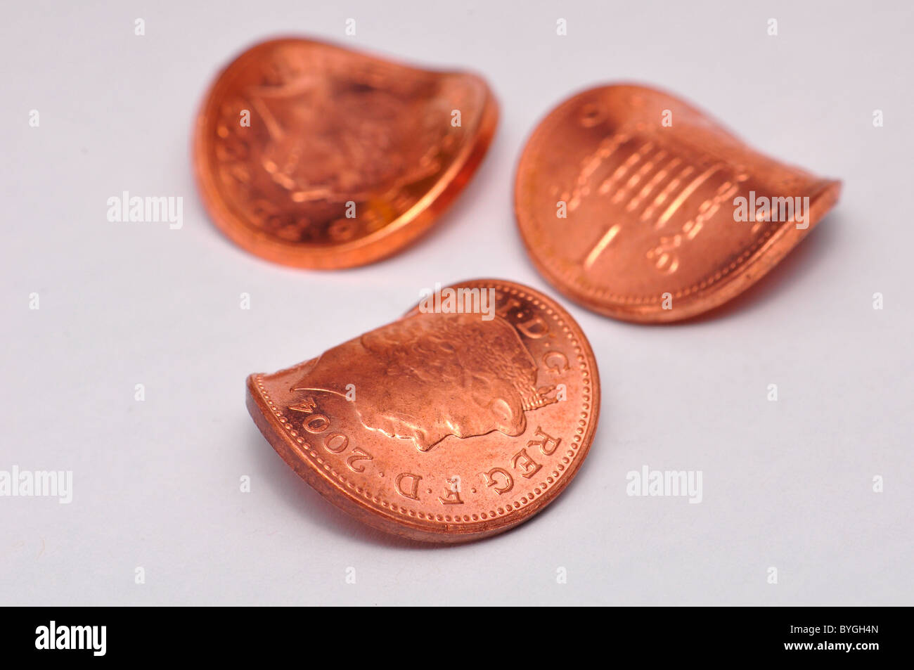 Three Bent Coppers, one penny coins Stock Photo