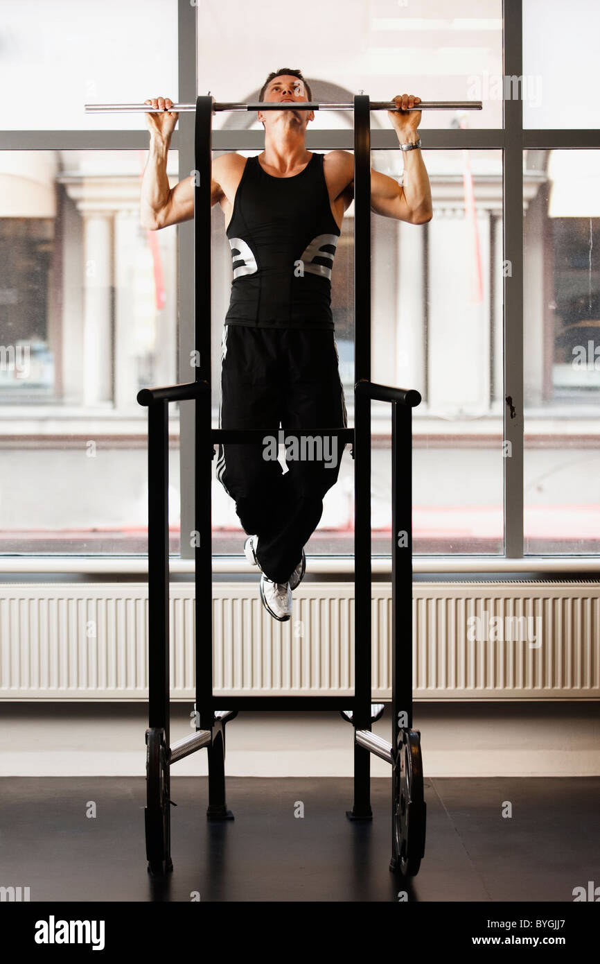 Male athlete doing pull ups in gym Stock Photo Alamy