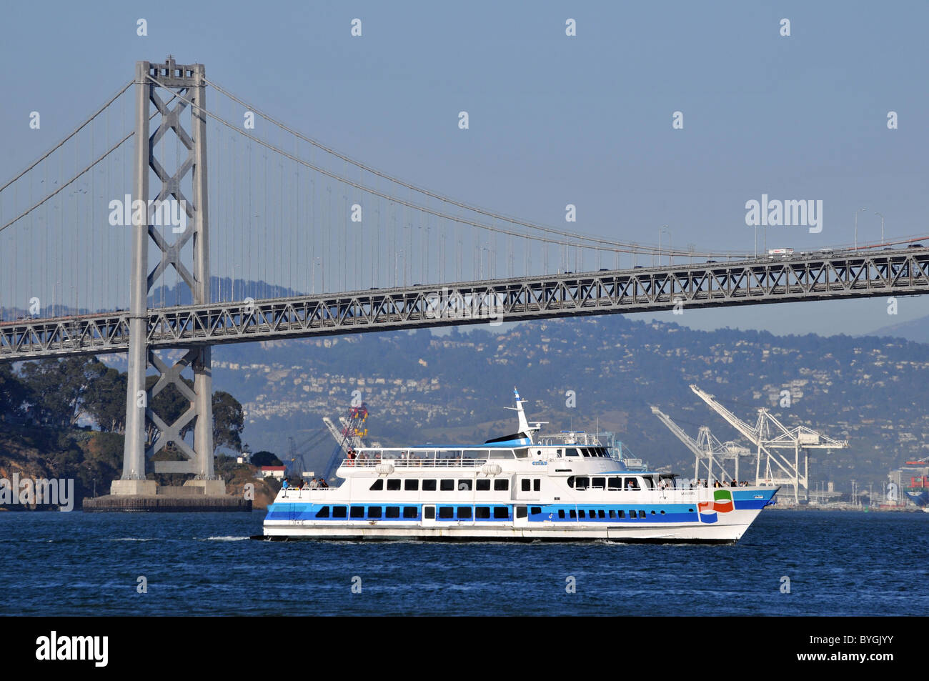 The ferry Marin of Golden Gate Ferry crossing in front of the Bay Bridge, San Francisco with