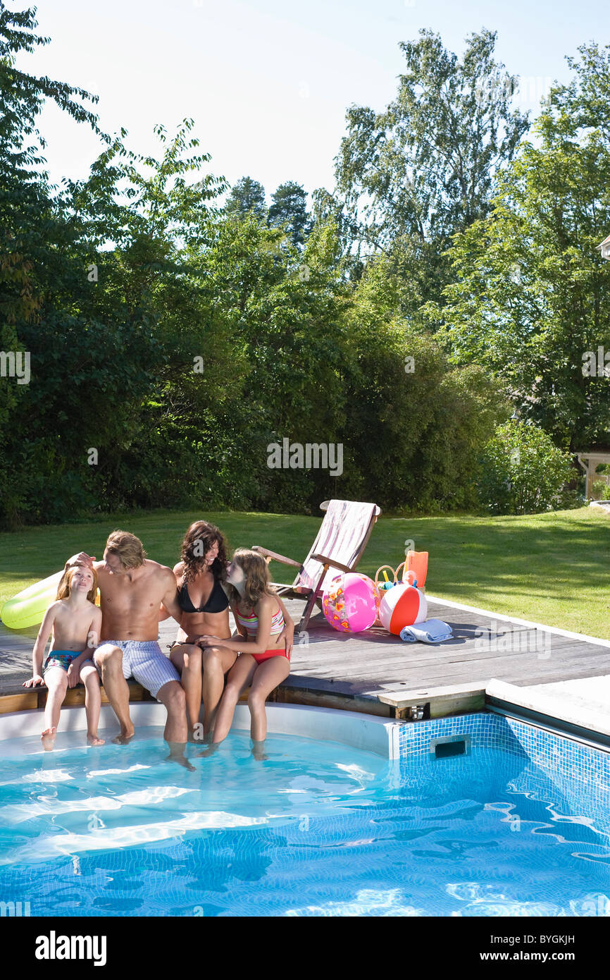 Two Couples Sitting By Swimming Pool High Resolution Stock Photography ...