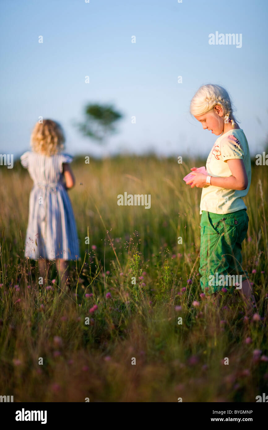 Two girls on meadow Stock Photo