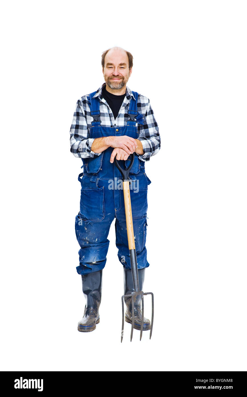 Studio portrait of farmer with pitchfork Stock Photo