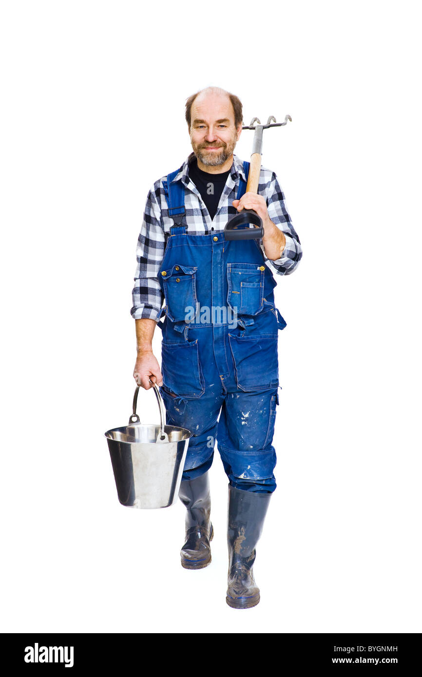 Studio portrait of farmer with pitchfork Stock Photo