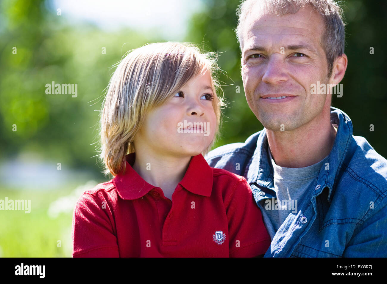 Father holds son in arms hi-res stock photography and images - Alamy