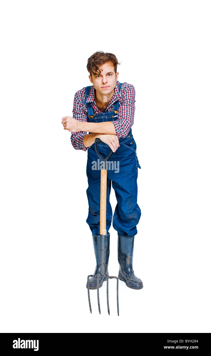 Studio shot of farmer with pitchfork Stock Photo