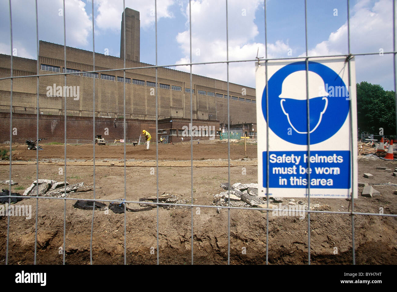 Temporary fencing and safety sign during conversion of Bankside Power Station into Tate Modern Museum of Modern Art. London. Stock Photo