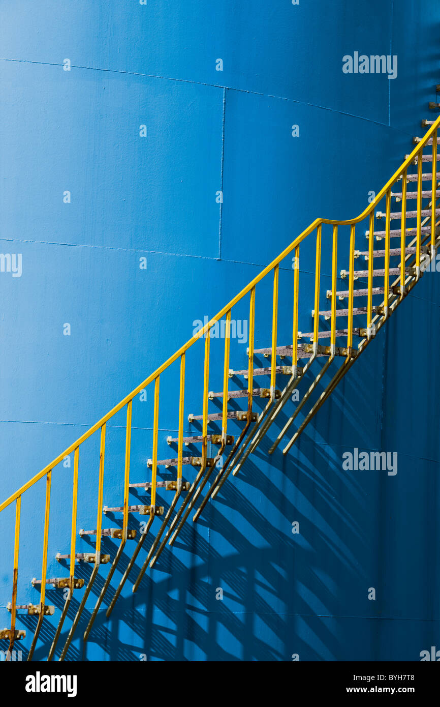 BLUE CHEMICAL STORAGE TANK WITH YELLOW STEPS Stock Photo