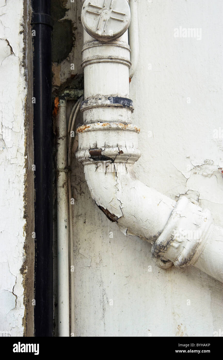 Peeling paint on a drainpipe Stock Photo Alamy