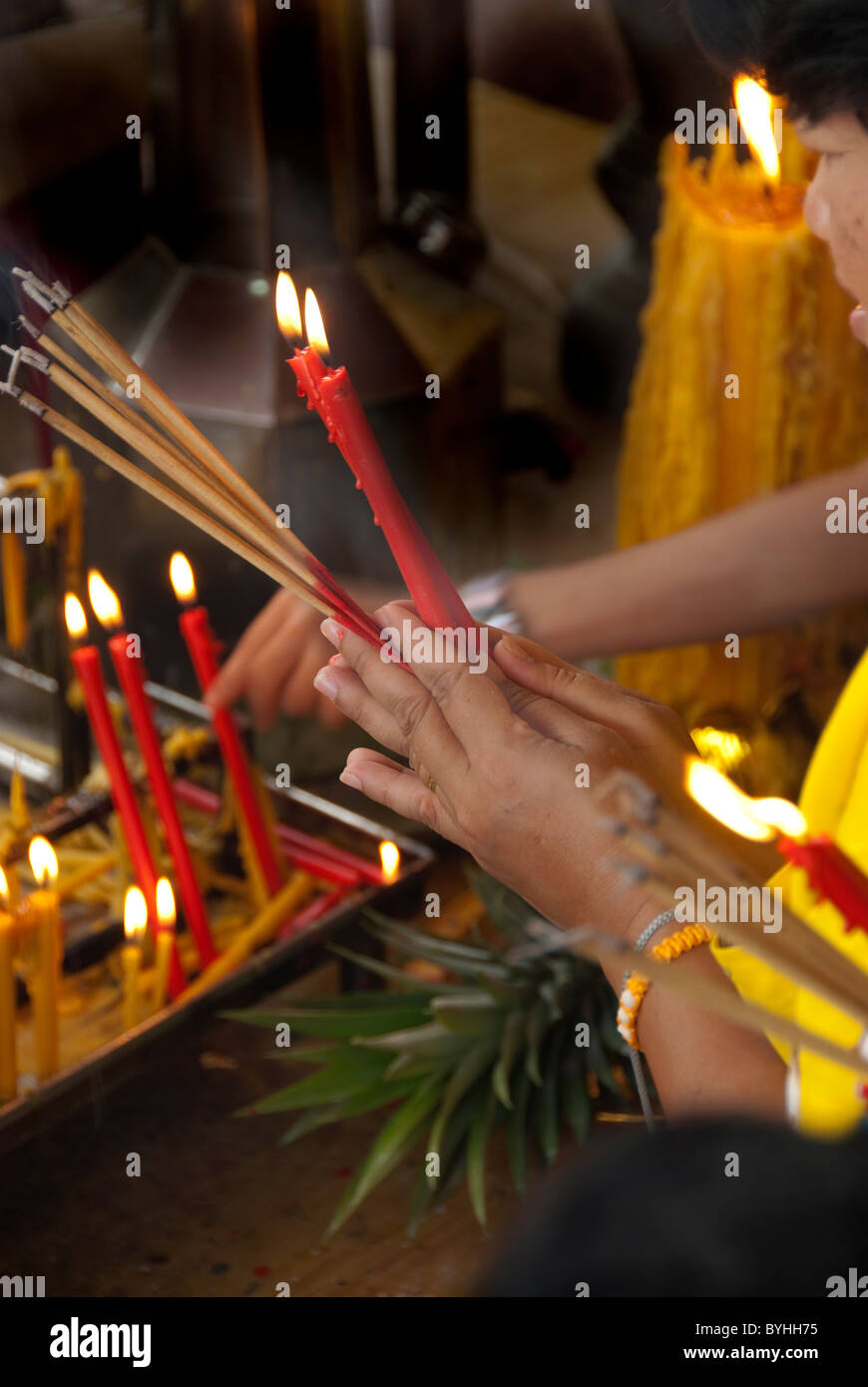 Woman's hands in prayer in Bangkok Stock Photo