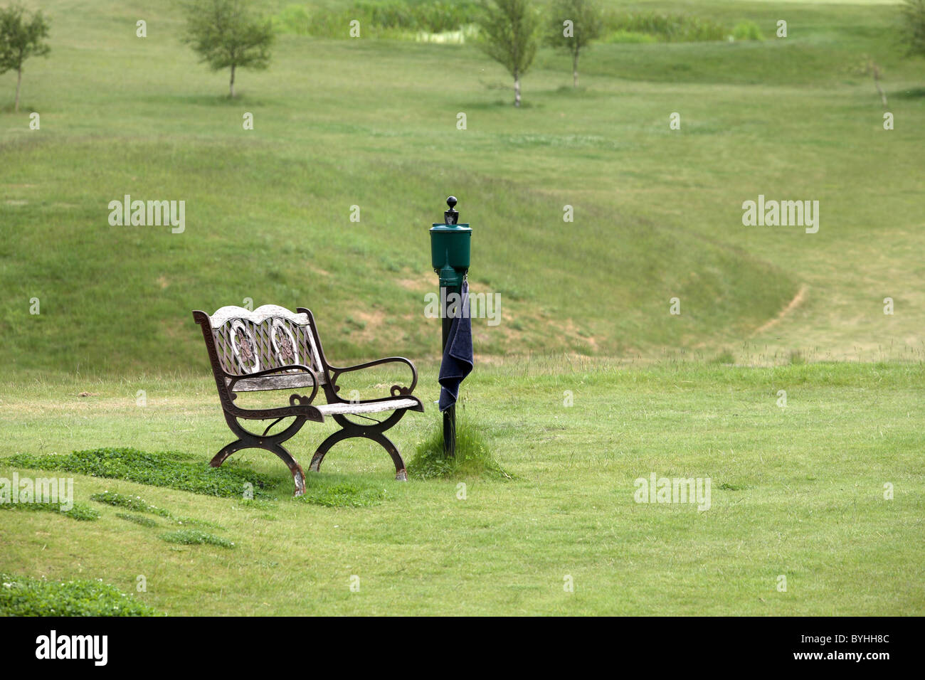 Bench on golf  course Stock Photo