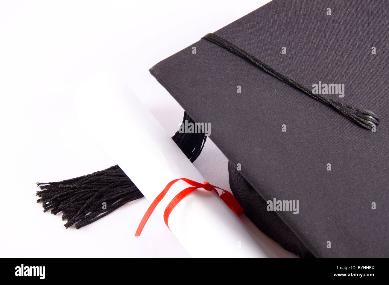 Student hat and diploma isolated on white Stock Photo