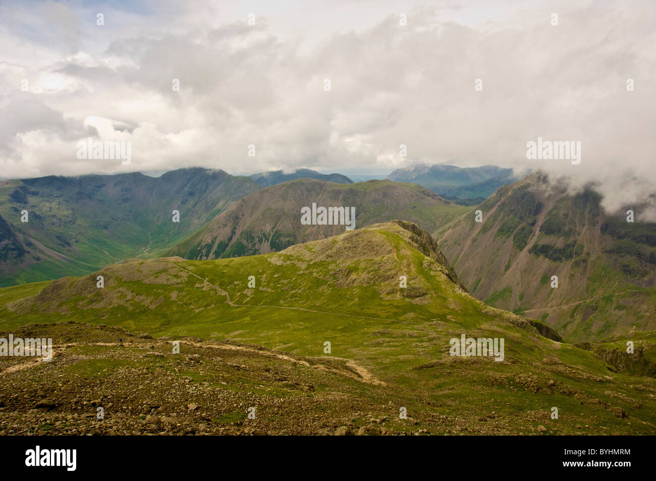 Lingmell (foreground) with Kirk Fell and Great Gable in background - from route down from Scafell Pike. Stock Photo