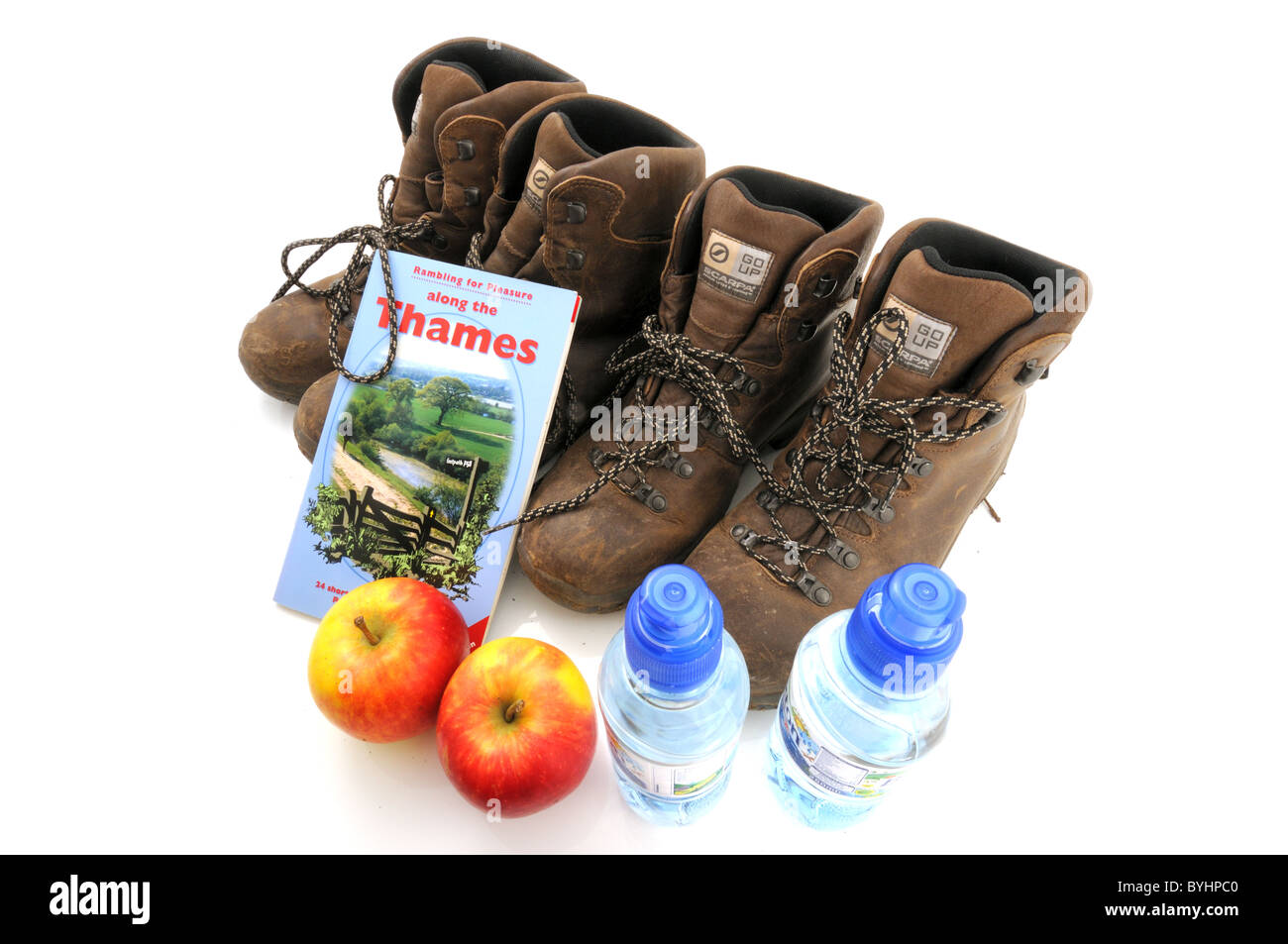Rambling for Pleasure along the Thames guide book with two pairs of walking boots taken in studio - Berkshire, UK Stock Photo