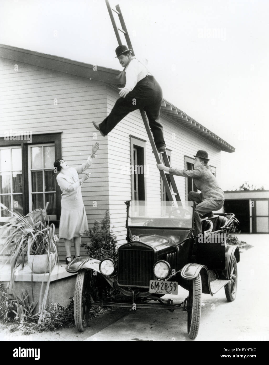 HOG WILD 1930 Hal Roach/MGM film with Stan Laurel in car, Oliver Hardy and Fay Holderness Stock Photo