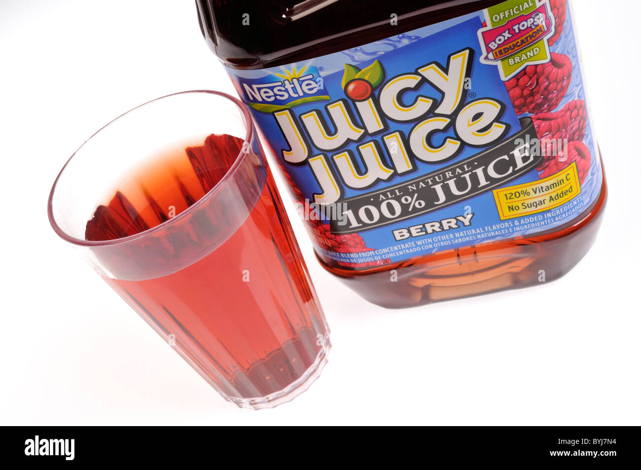 Plastic jug of berry Juicy Juice with poured glass on white background