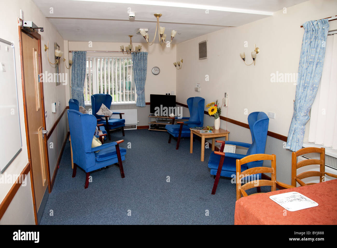An empty lounge in an elderly nursing care home England UK Stock Photo