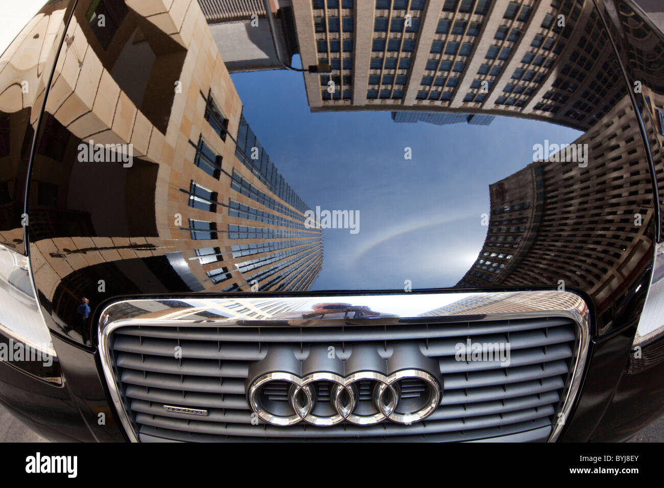 USA, Minnesota, Minneapolis, Reflection of office building in Audi car's hood Stock Photo