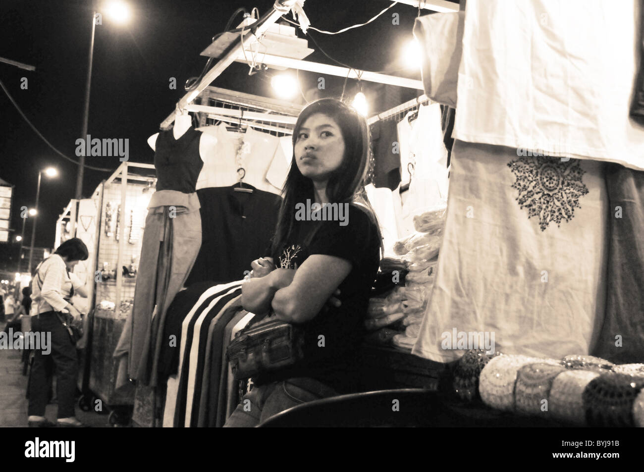 Sepia-toned portrait of a seller at a Thai street market Stock Photo