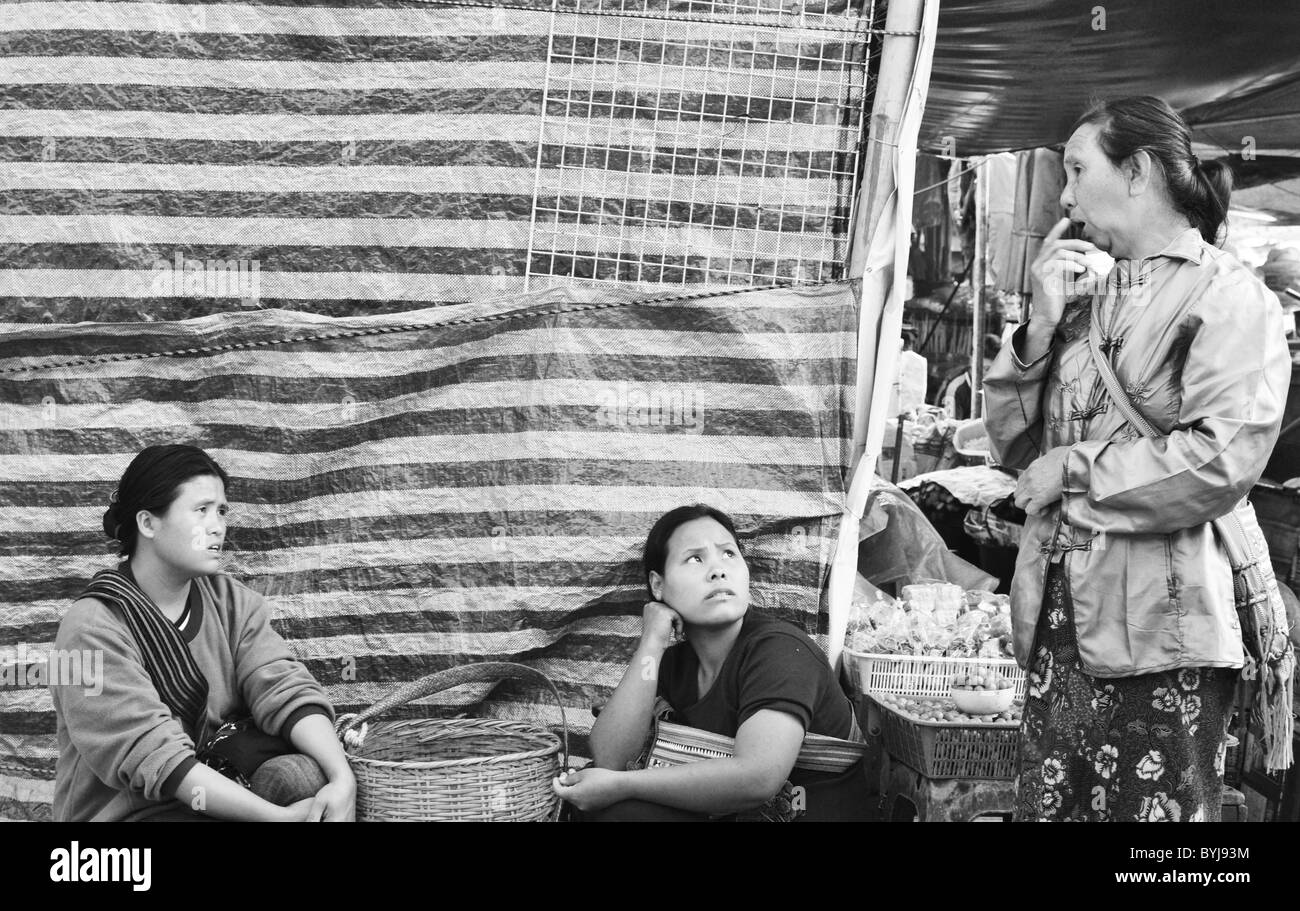 Black and white photograph of sellers at a Thai street market Stock Photo