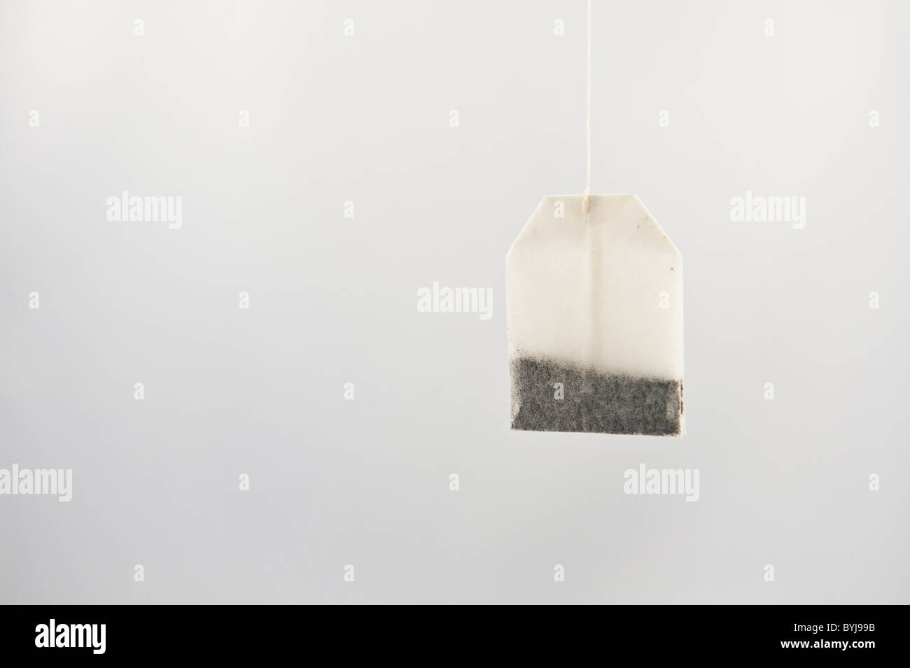 New tea bag hanging by string Stock Photo Alamy