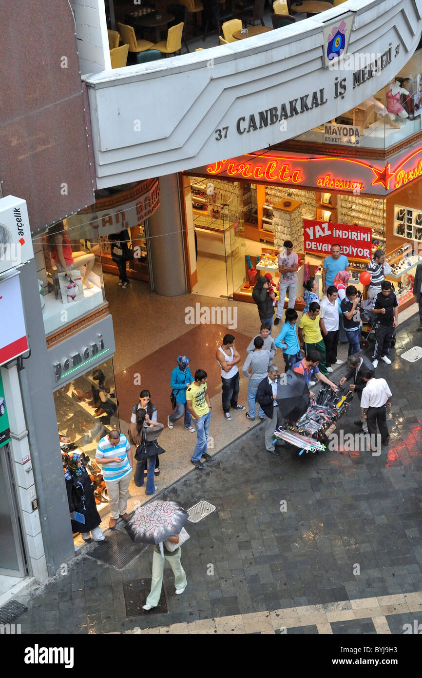 Umbrella salesman in the rain, Shopping, Trabzon, Turkey 100930 38089 Stock Photo