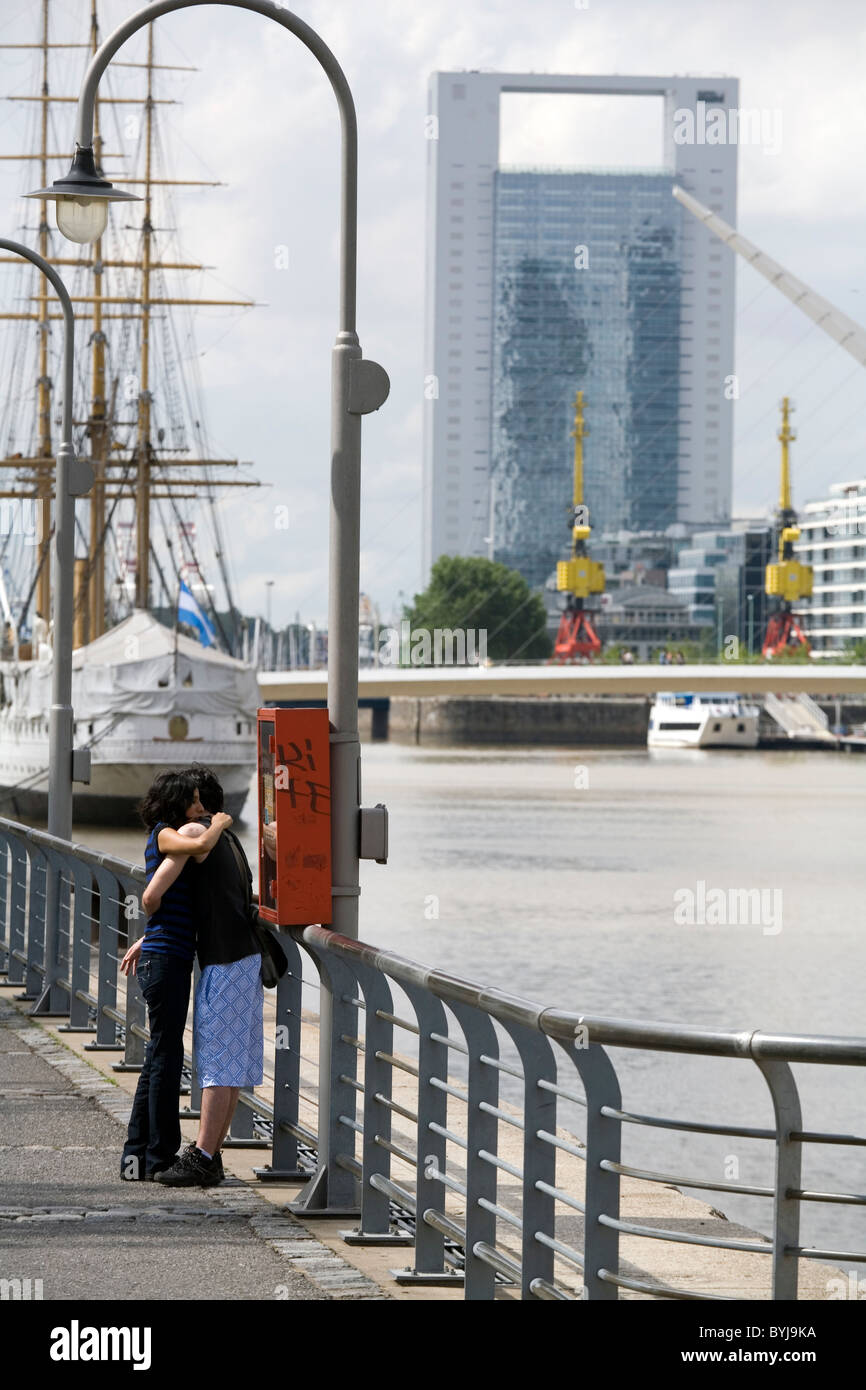 Couple embracing along the dock of Puerto Madero, Buenos Aires, Argentina Stock Photo