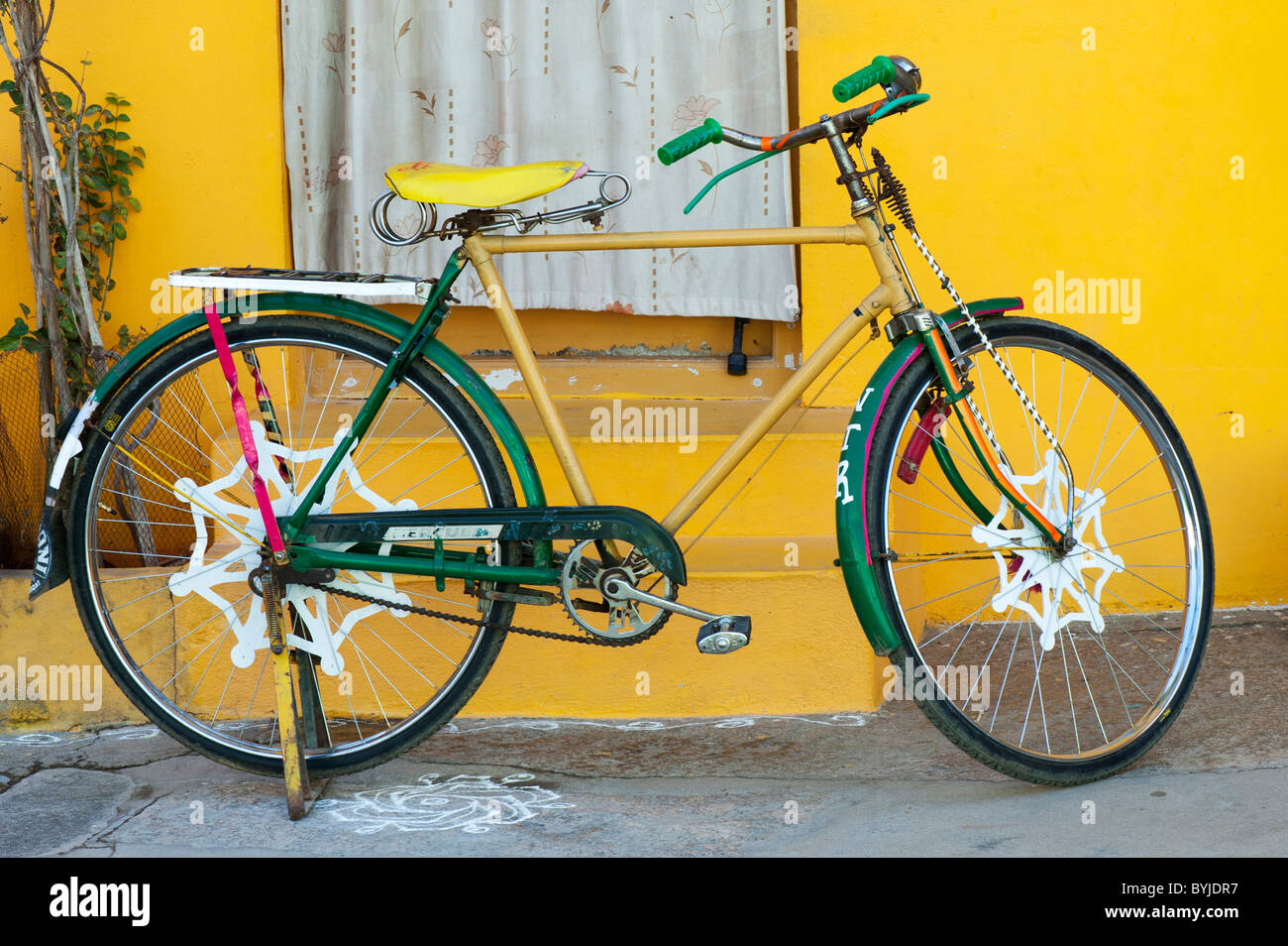 Traditional Indian bicycle against a yellow indian house. Andhra Pradesh, India Stock Photo Alamy