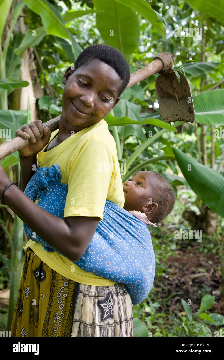 African woman carrying baby on back hires stock photography and images
