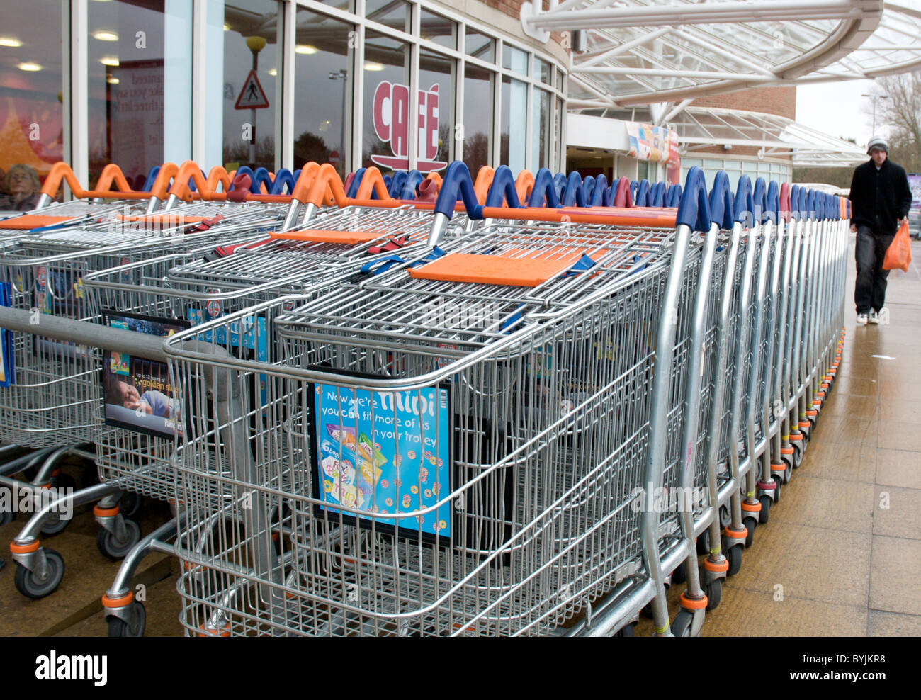 Exterior of large store showing the shopping trolleys. Stock Photo